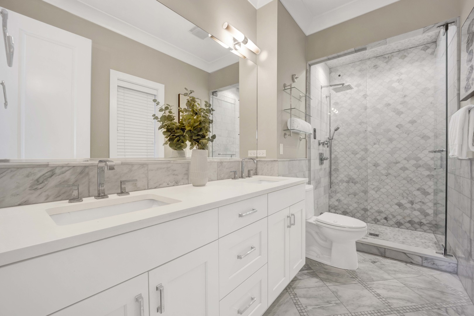 2652 North Racine Avenue, Unit 2 Chicago, IL 60614 - Photo 10 of 17 a bathroom with a double vanity sink toilet and shower