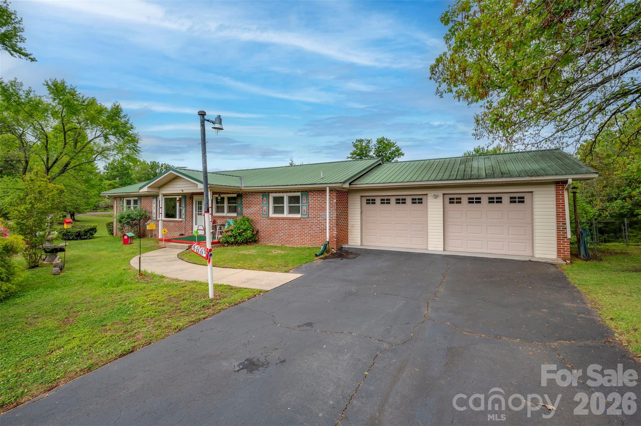 4665 Highway 9 Mill Spring, NC 28756 - Photo 1 of 46 a front view of a house with a yard