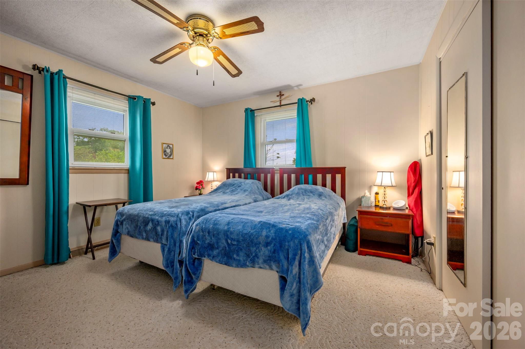 4665 Highway 9 Mill Spring, NC 28756 - Photo 13 of 46 a bedroom with a bed and a chandelier