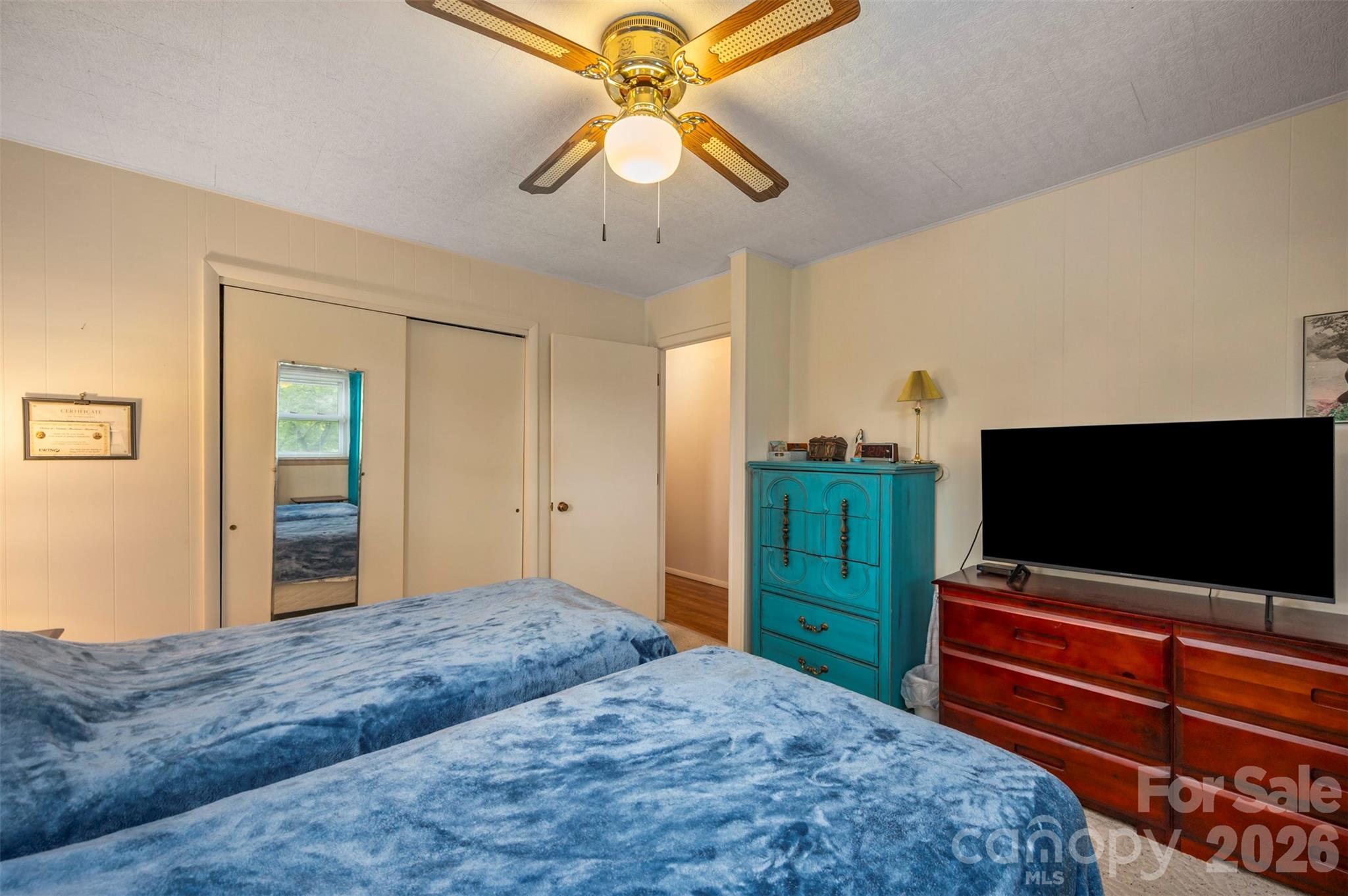 4665 Highway 9 Mill Spring, NC 28756 - Photo 14 of 46 a bedroom with a bed and a flat screen tv