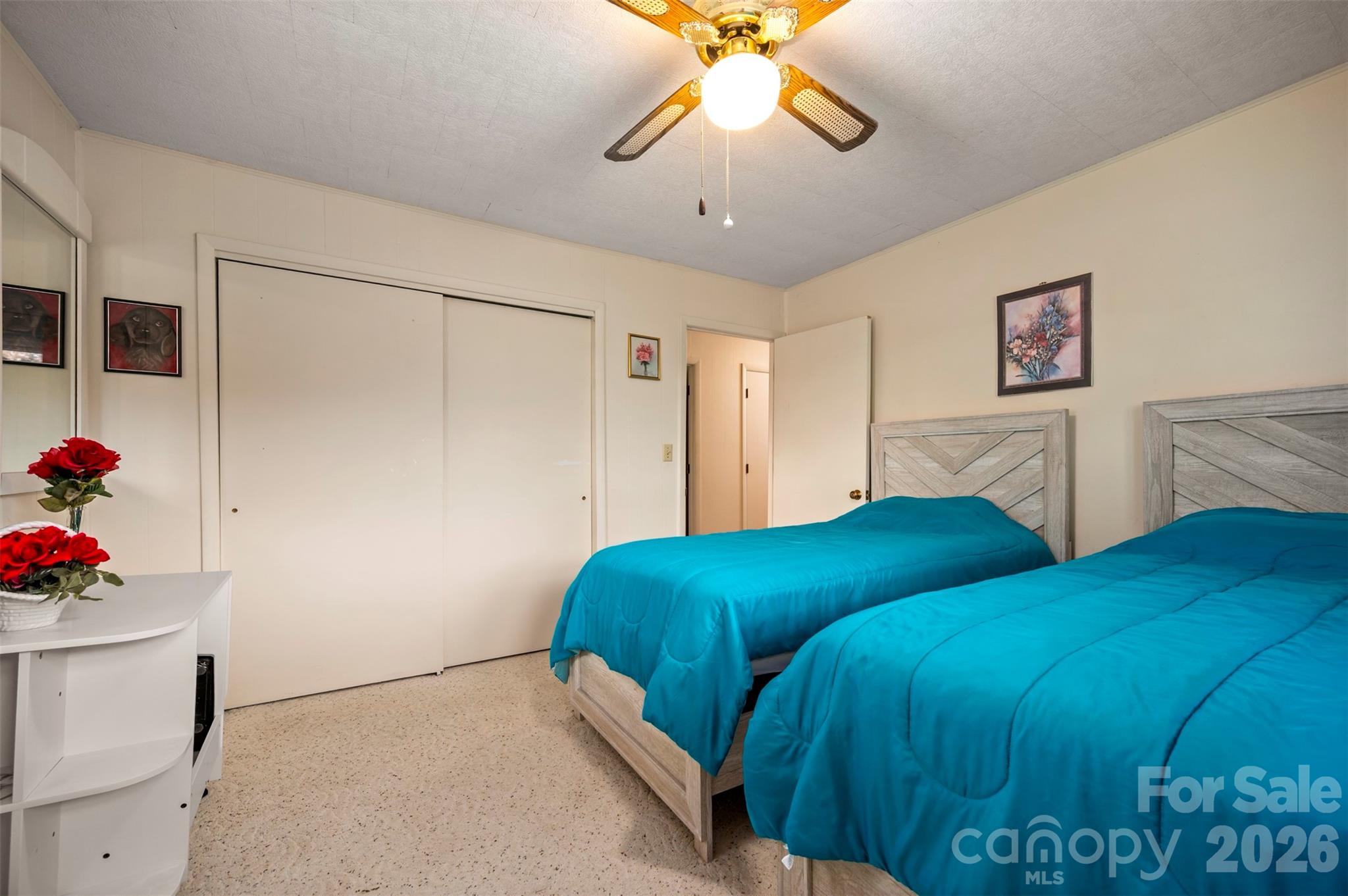 4665 Highway 9 Mill Spring, NC 28756 - Photo 17 of 46 a bedroom with a bed and a chandelier