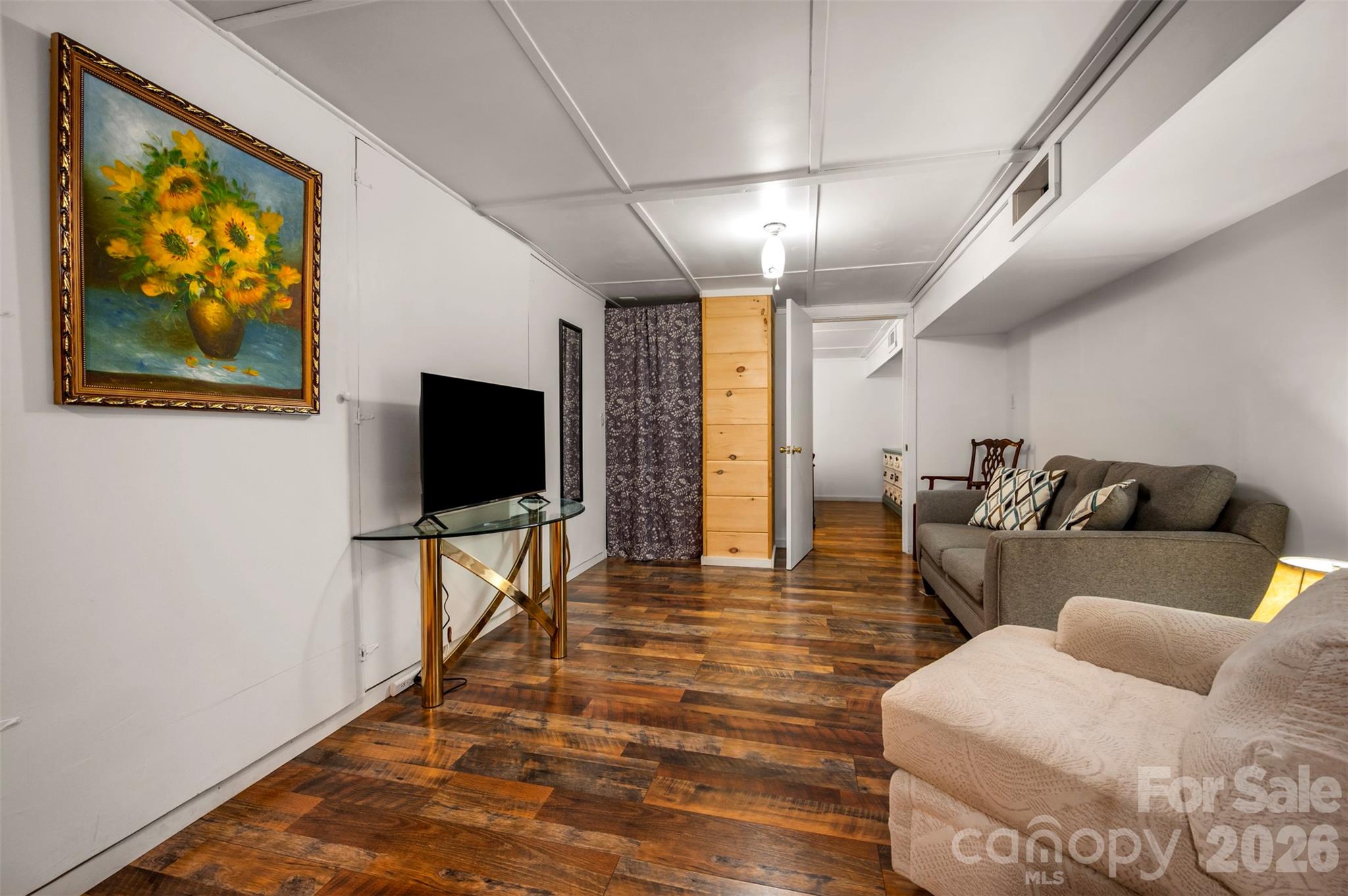 4665 Highway 9 Mill Spring, NC 28756 - Photo 20 of 46 a living room with furniture and a flat screen tv