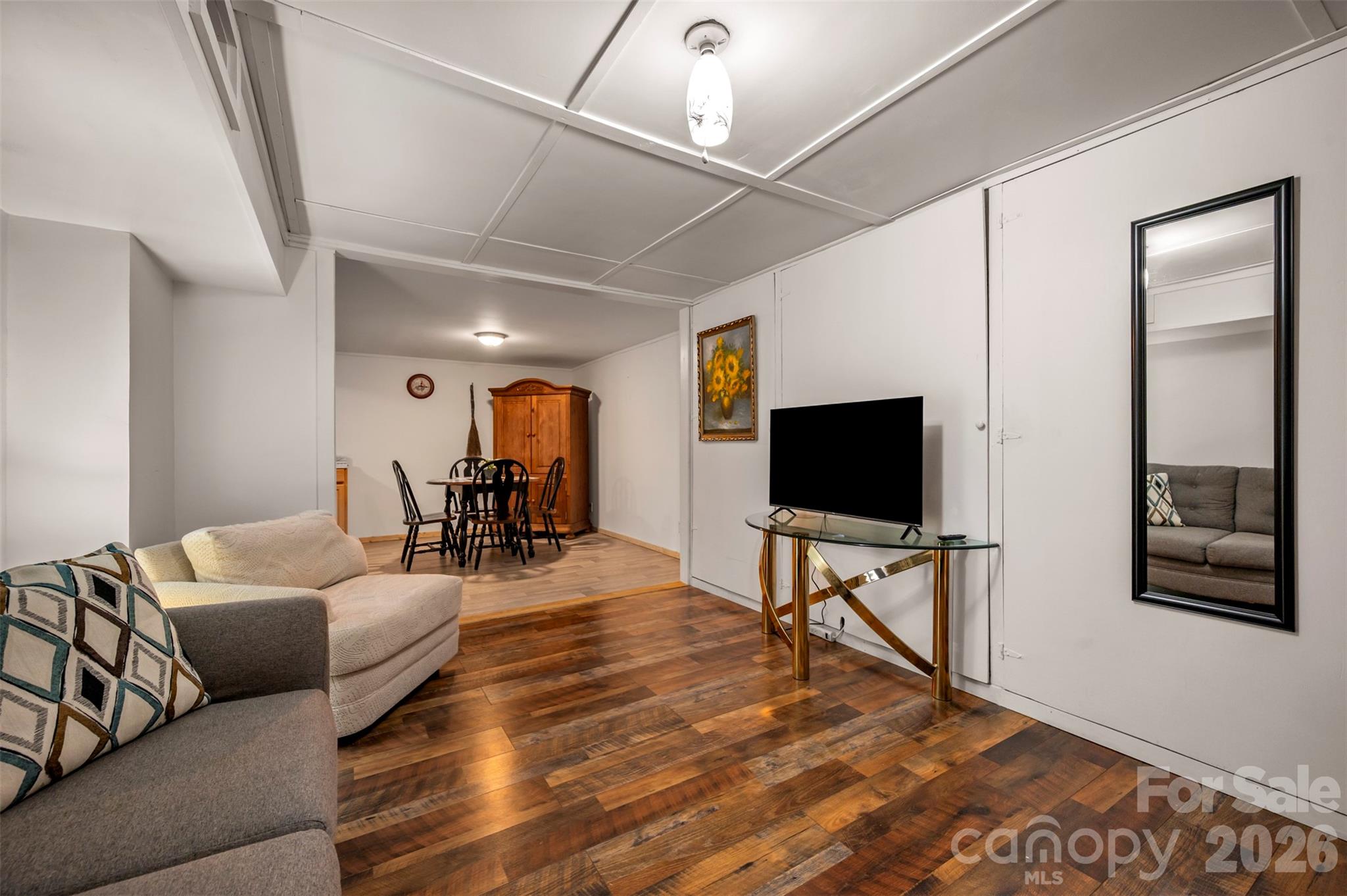 4665 Highway 9 Mill Spring, NC 28756 - Photo 21 of 46 a living room with furniture and a flat screen tv