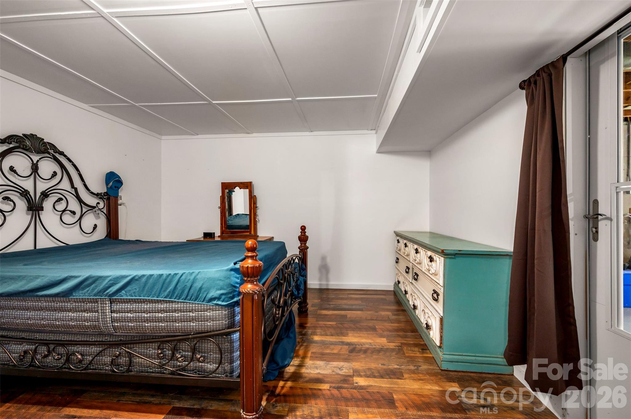 4665 Highway 9 Mill Spring, NC 28756 - Photo 22 of 46 a bedroom with furniture and a window