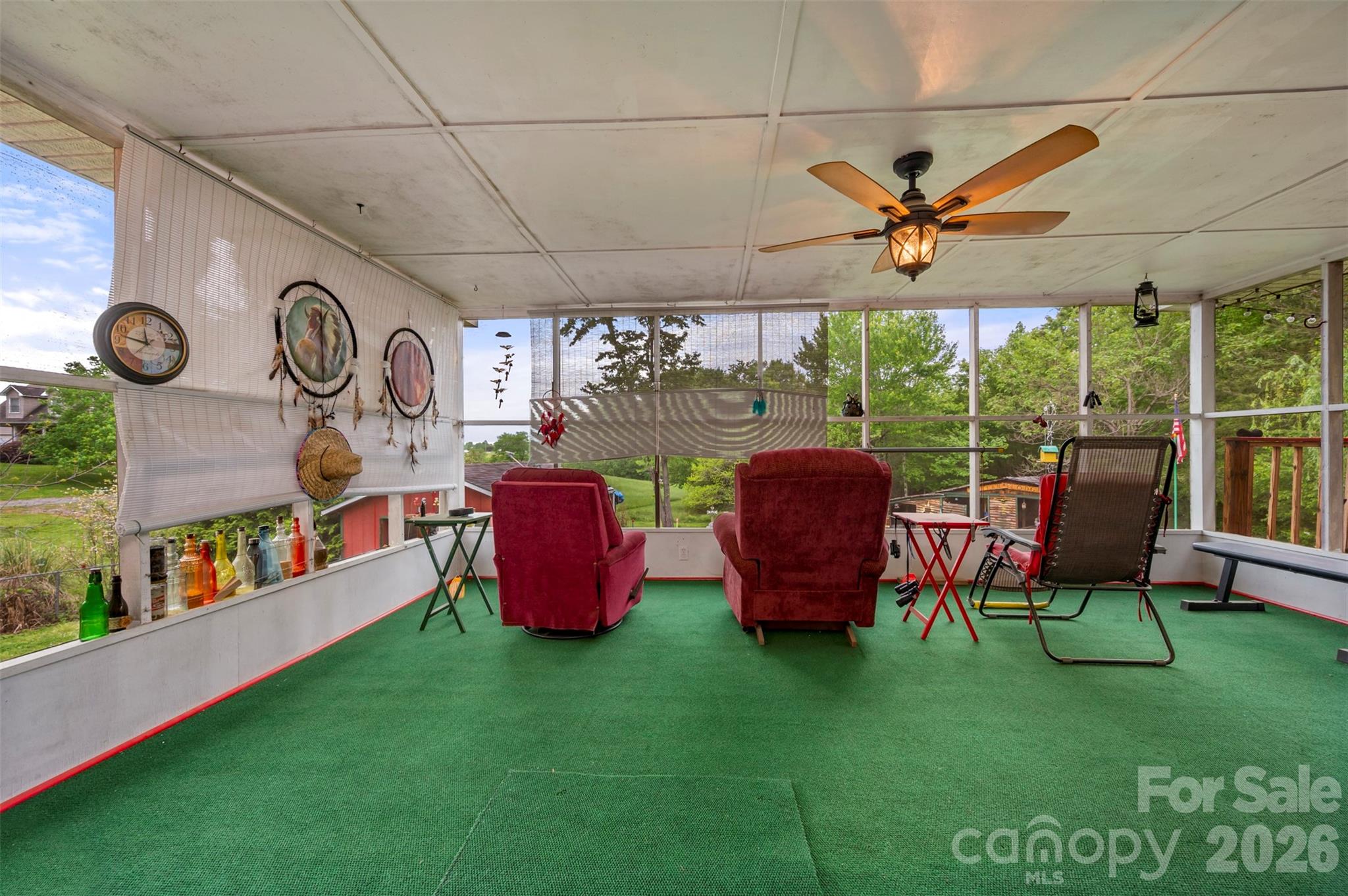 4665 Highway 9 Mill Spring, NC 28756 - Photo 27 of 46 a view of a chairs and table in a patio