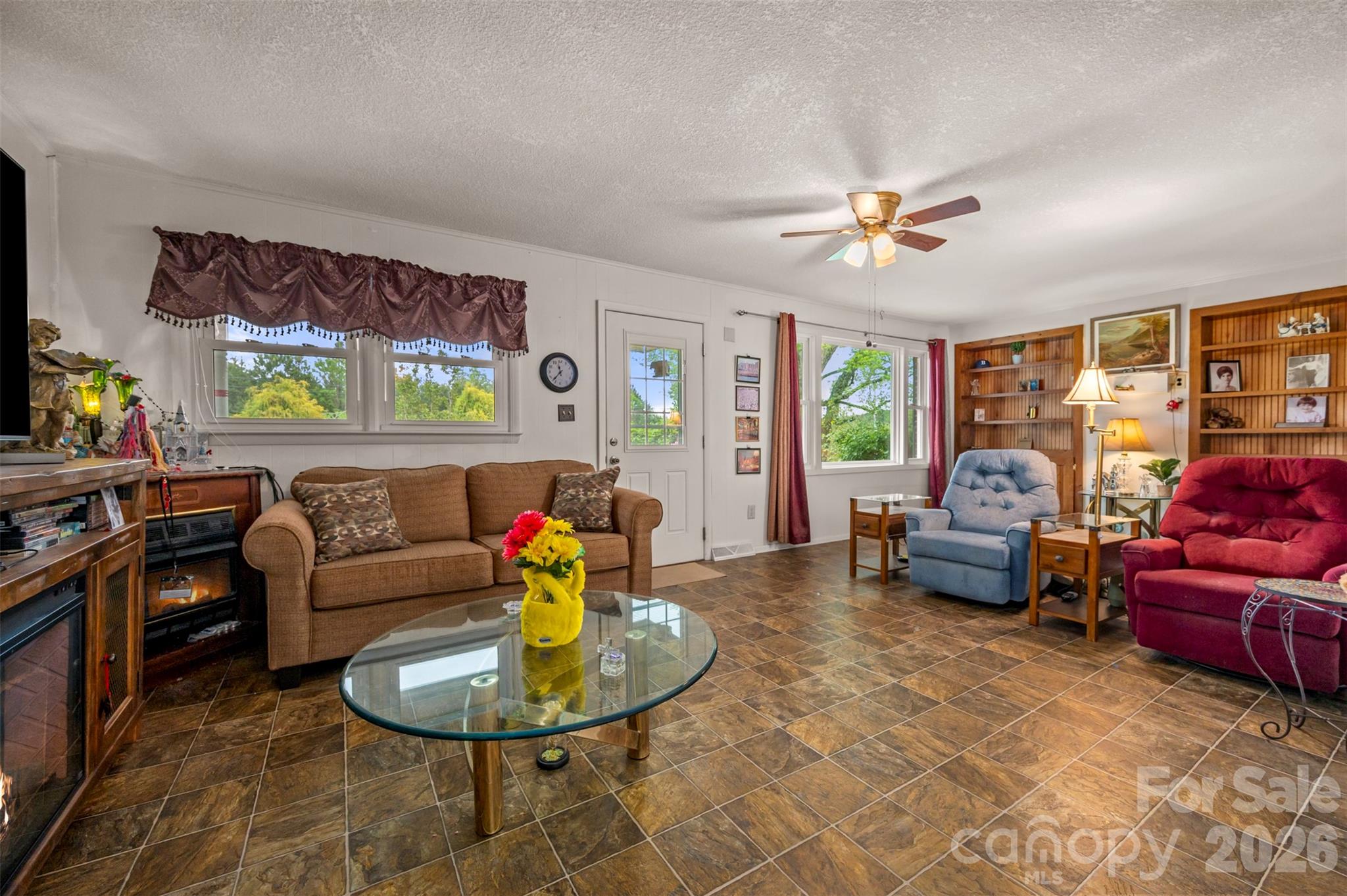 4665 Highway 9 Mill Spring, NC 28756 - Photo 3 of 46 a living room with furniture and a large window