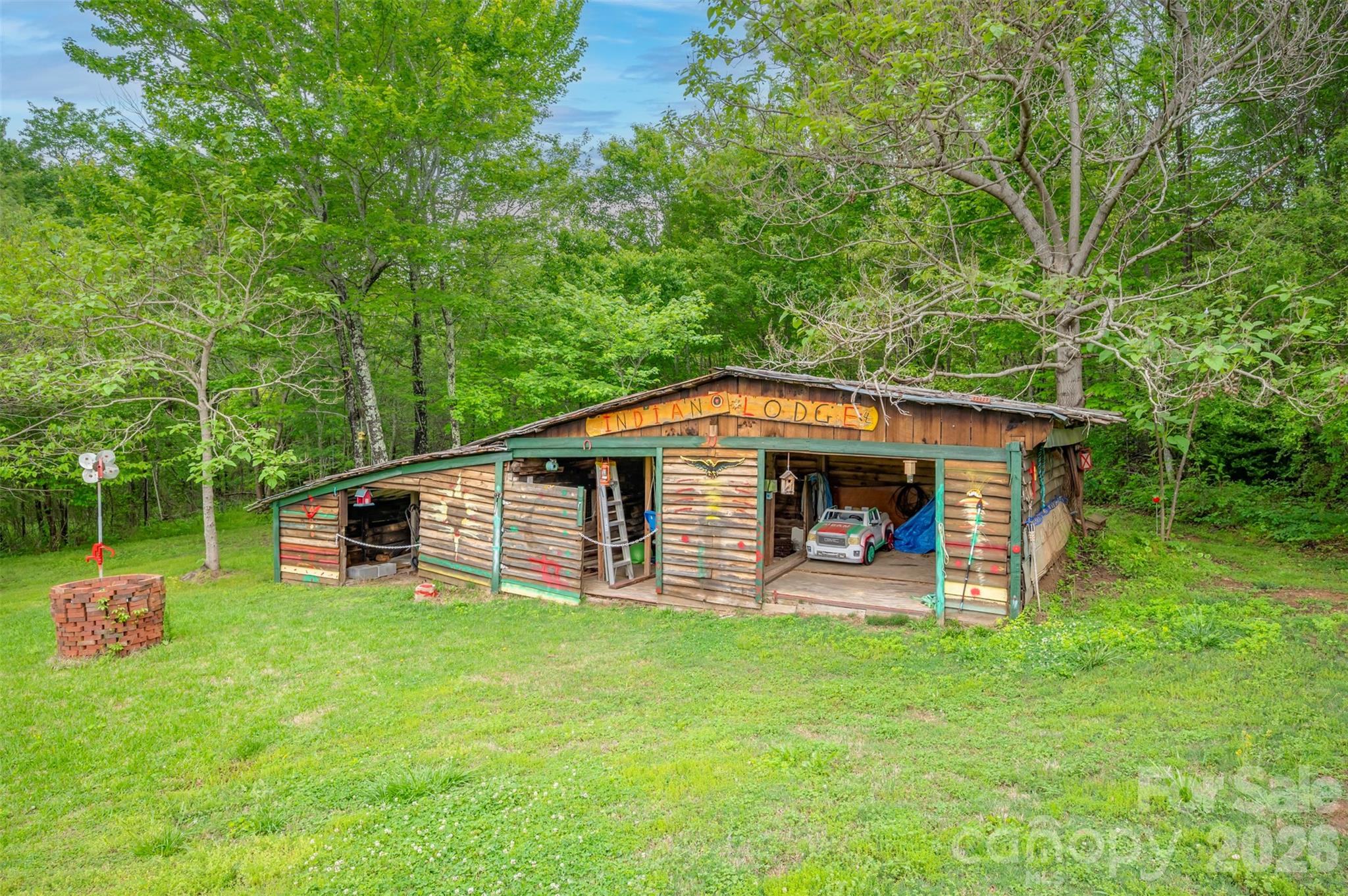 4665 Highway 9 Mill Spring, NC 28756 - Photo 33 of 46 a front view of a house with garden