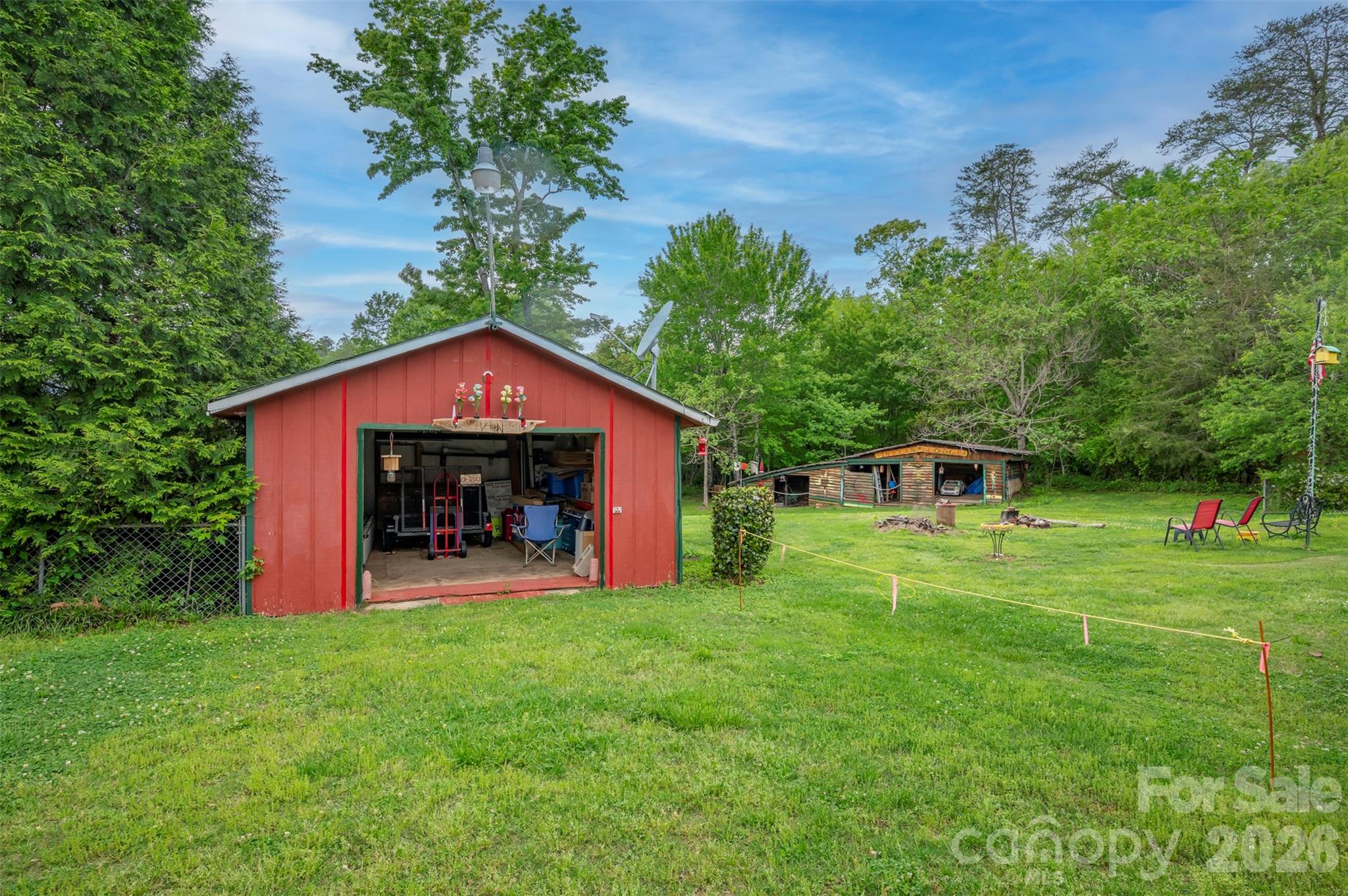 4665 Highway 9 Mill Spring, NC 28756 - Photo 34 of 46 a front view of a house with garden