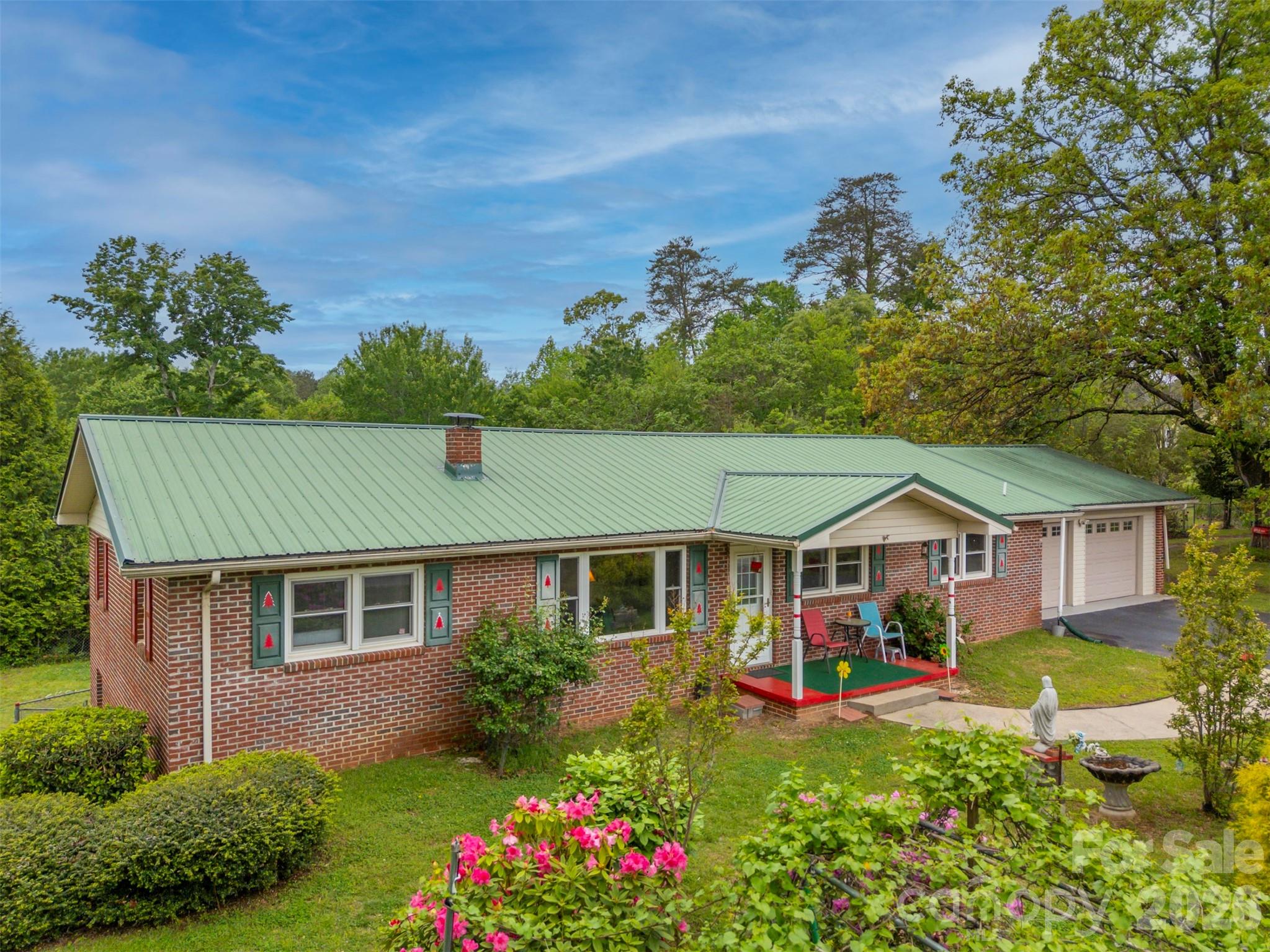 4665 Highway 9 Mill Spring, NC 28756 - Photo 37 of 46 front view of a house with a yard