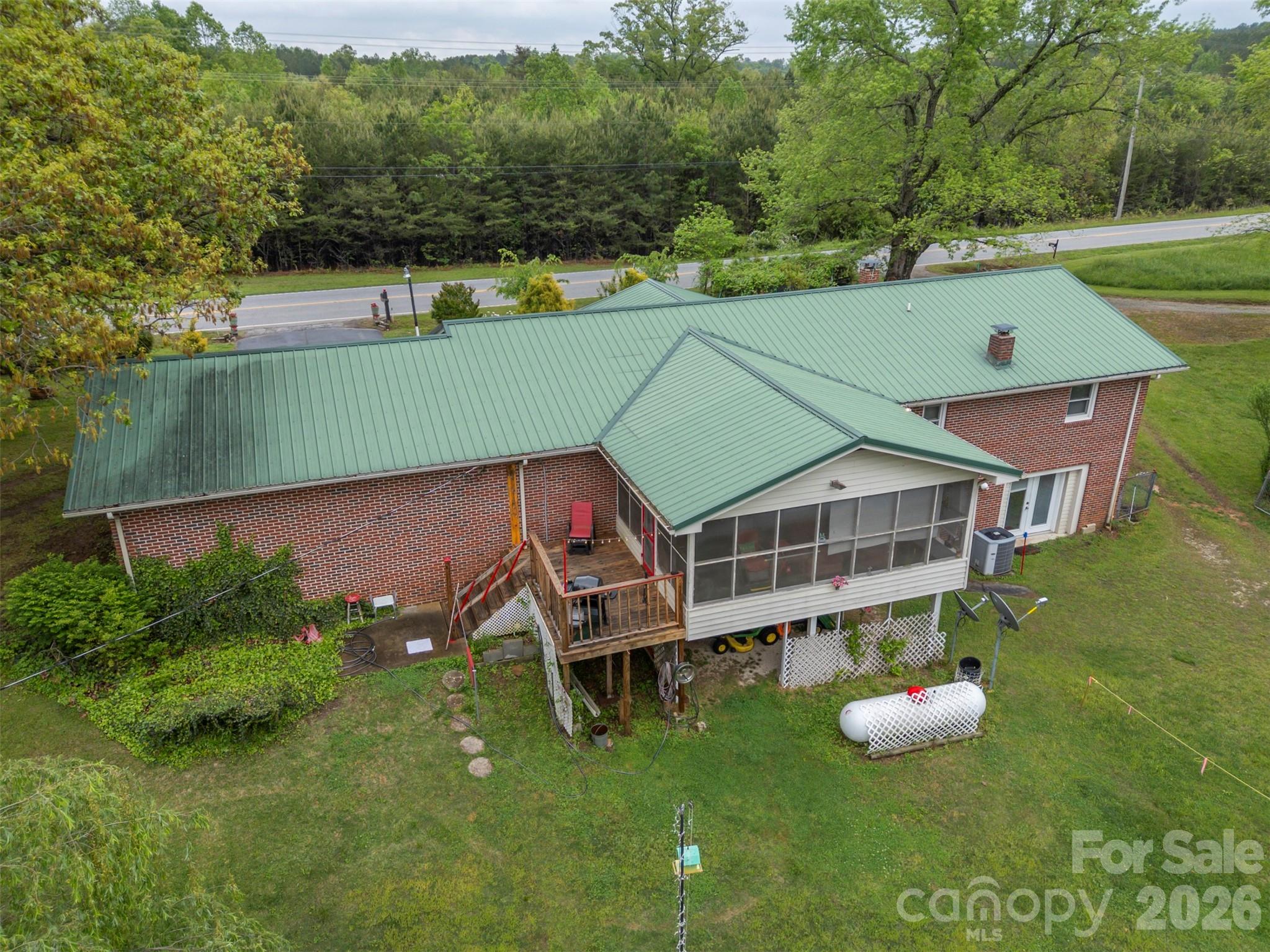 4665 Highway 9 Mill Spring, NC 28756 - Photo 43 of 46 an aerial view of a house with a yard
