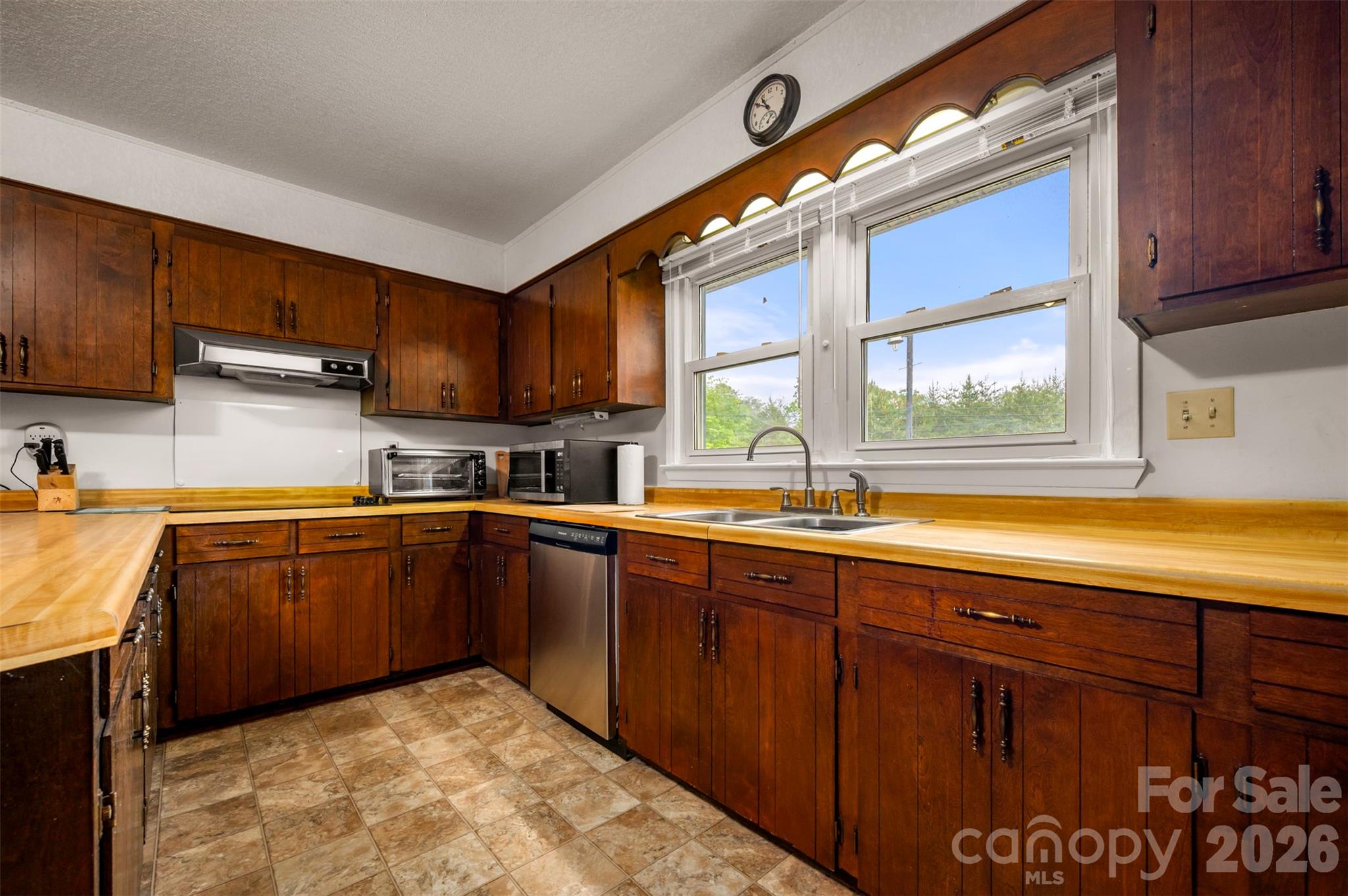 4665 Highway 9 Mill Spring, NC 28756 - Photo 9 of 46 a kitchen with stainless steel appliances granite countertop a sink stove and cabinets