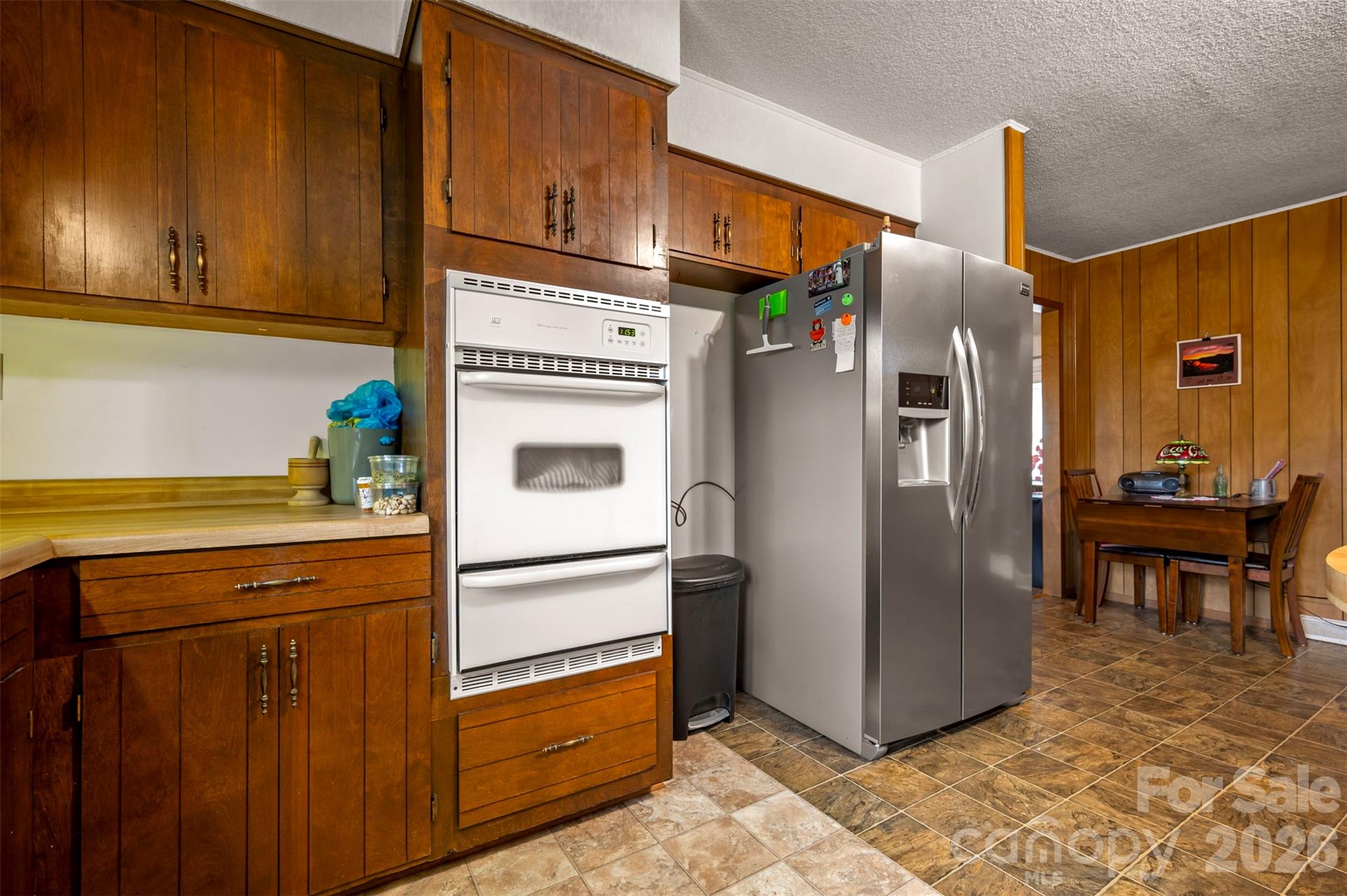4665 Highway 9 Mill Spring, NC 28756 - Photo 10 of 46 a kitchen with stainless steel appliances granite countertop a refrigerator and a stove