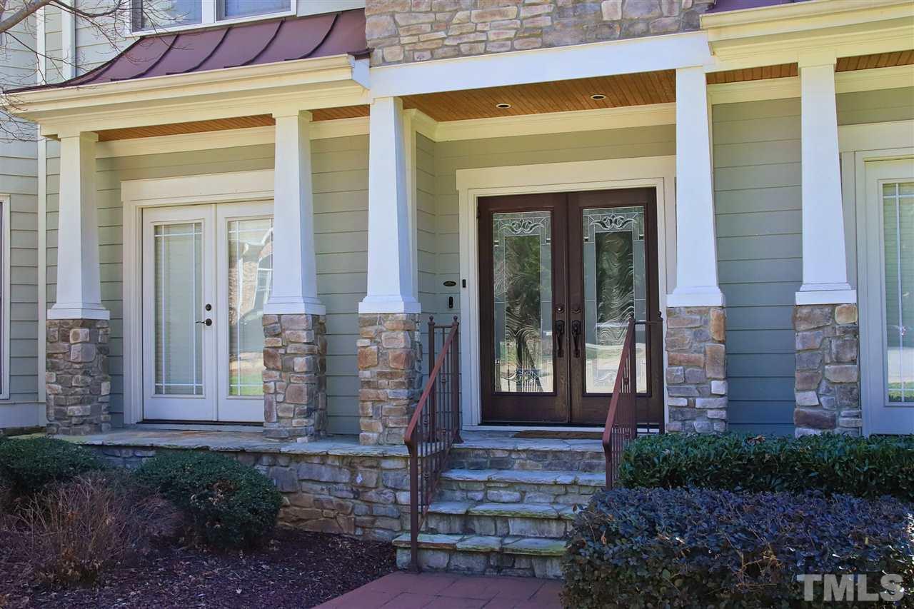 5706 Belmont Valley Court Raleigh, NC 27612 - Photo 2 of 6 a front view of a house with a garden