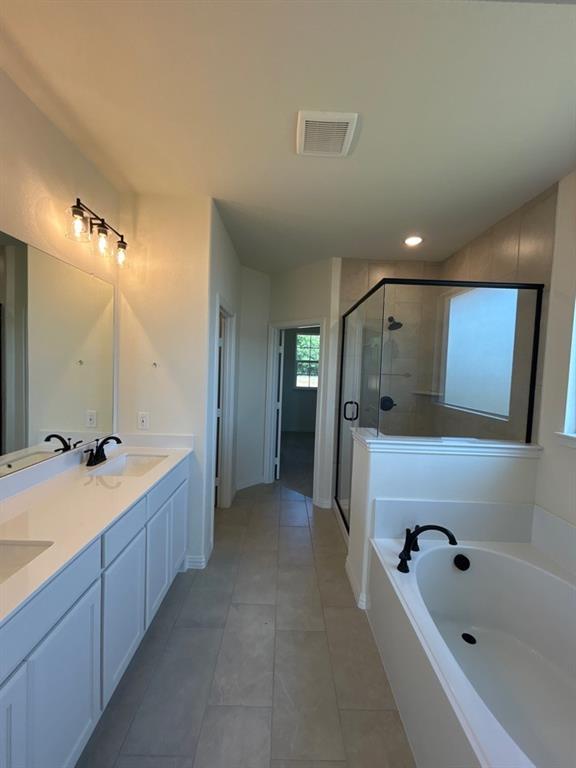 8813 County Road 623 Blue Ridge, TX 75424 - Photo 11 of 19 Spacious bathroom featuring a dual vanity with white cabinetry and light-toned countertops