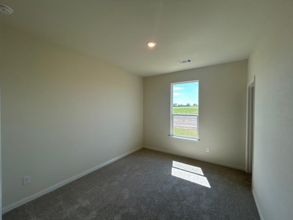 8813 County Road 623 Blue Ridge, TX 75424 - Photo 12 of 19 Room featuring neutral-toned walls, recessed lighting, and grey carpeting