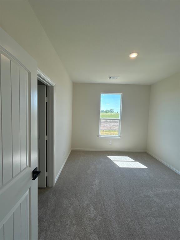 8813 County Road 623 Blue Ridge, TX 75424 - Photo 14 of 19 Carpeted room with recessed lighting and a single window offering exterior scenery