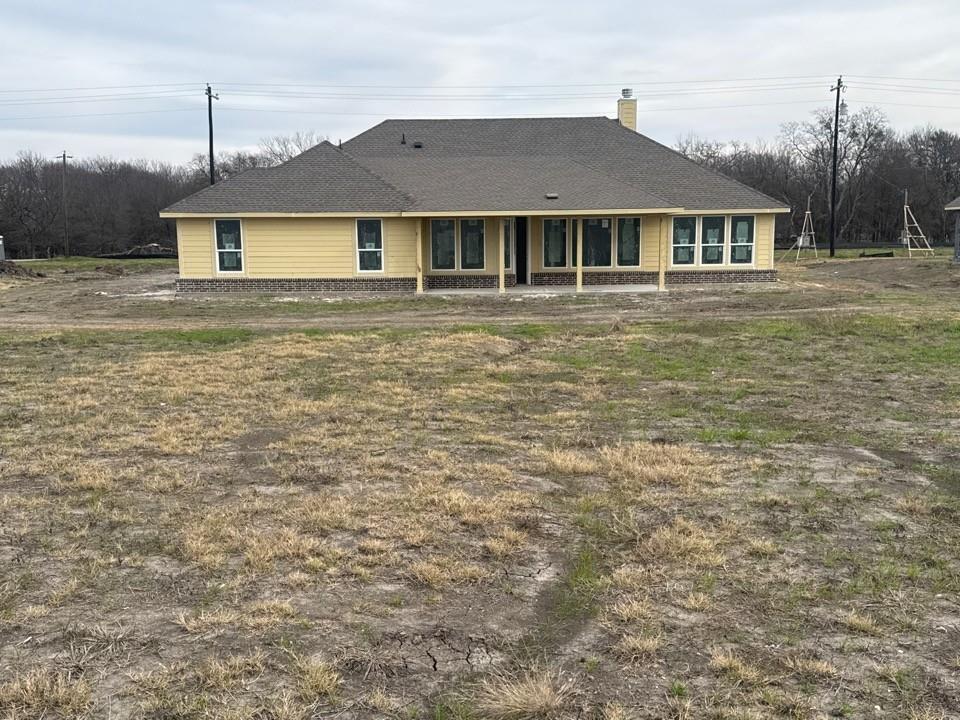8813 County Road 623 Blue Ridge, TX 75424 - Photo 14 of 20 a front view of a house with a yard