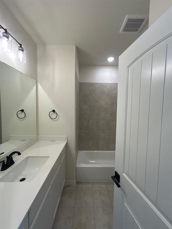 8813 County Road 623 Blue Ridge, TX 75424 - Photo 15 of 19 Bathroom featuring a white vanity with an integrated sink, matte black faucet, and a large mirror