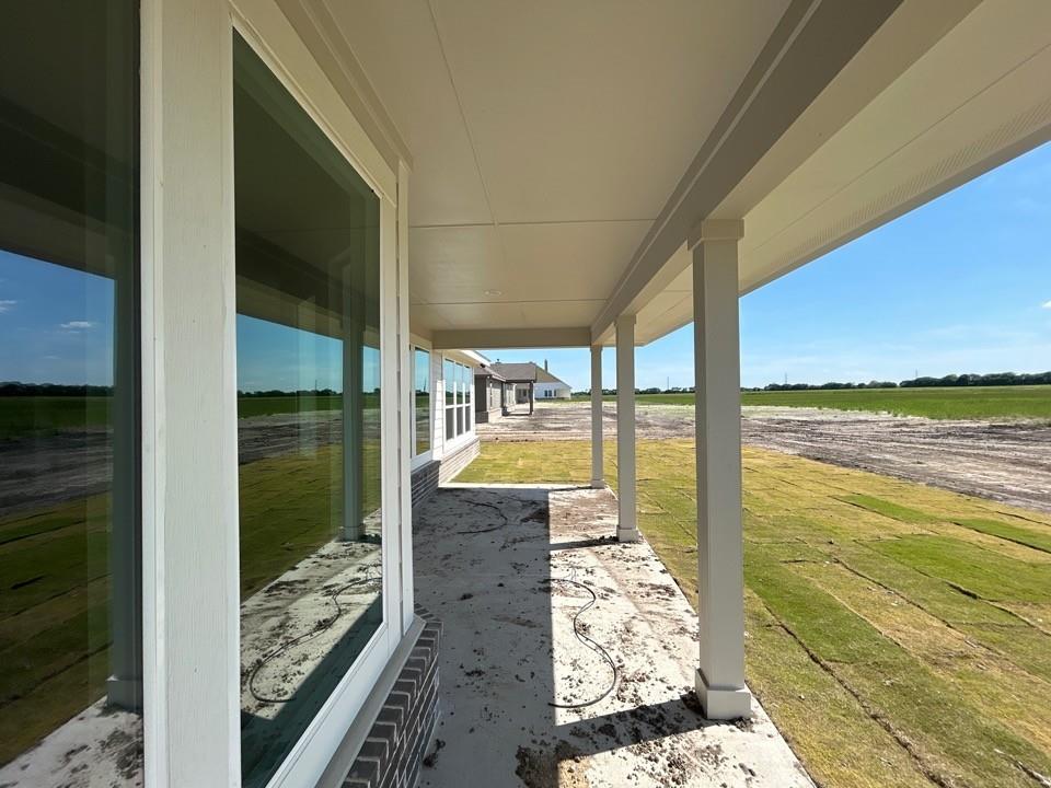 8813 County Road 623 Blue Ridge, TX 75424 - Photo 17 of 19 Expansive covered patio featuring a concrete surface and substantial support columns