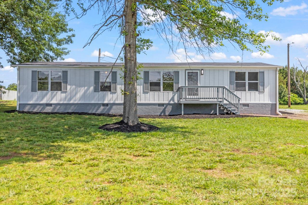5354 Sherrills Ford Road Catawba, NC 28609 - Photo 1 of 44 a front view of a house with a yard table and chairs