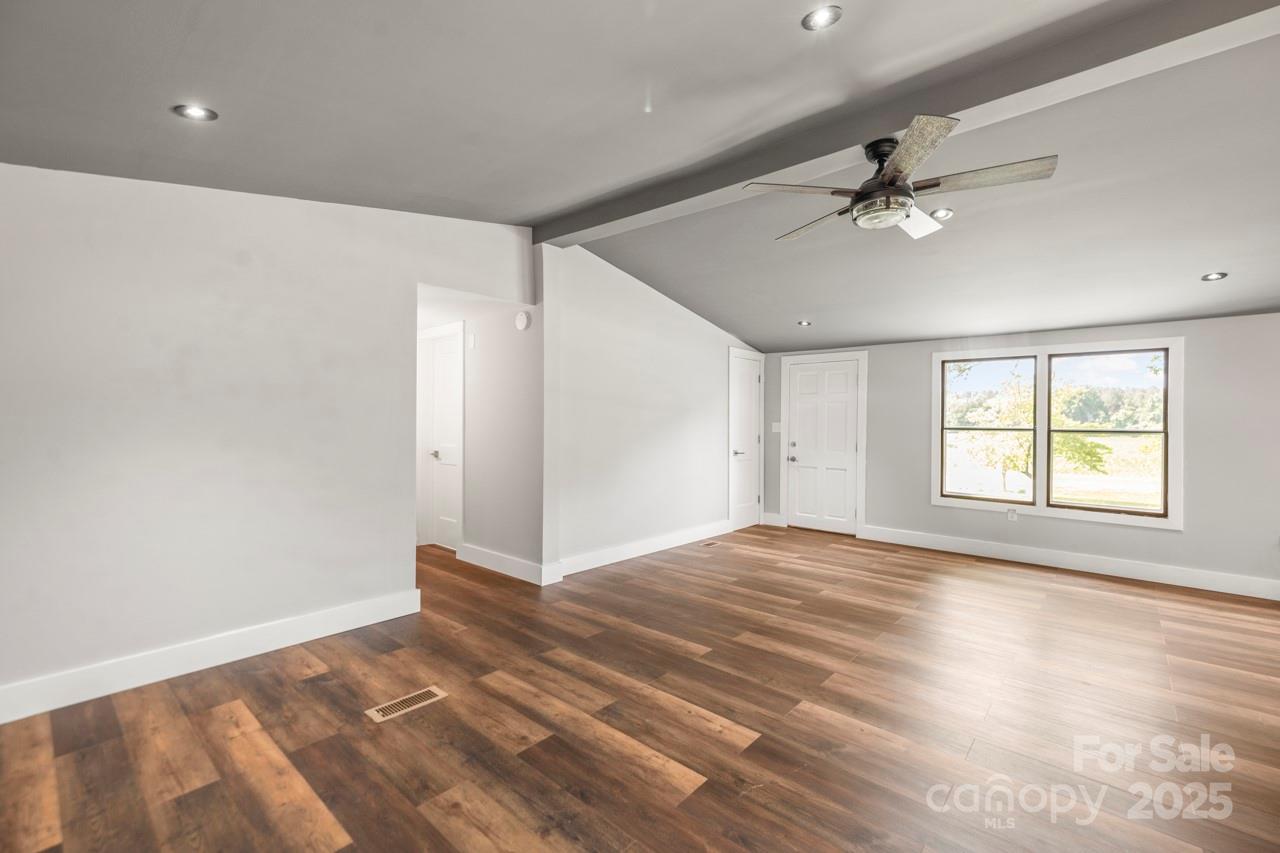 5354 Sherrills Ford Road Catawba, NC 28609 - Photo 13 of 44 a view of empty room with wooden floor and fan