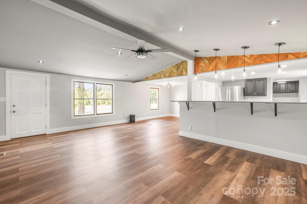 5354 Sherrills Ford Road Catawba, NC 28609 - Photo 14 of 44 an empty room with wooden floor and windows