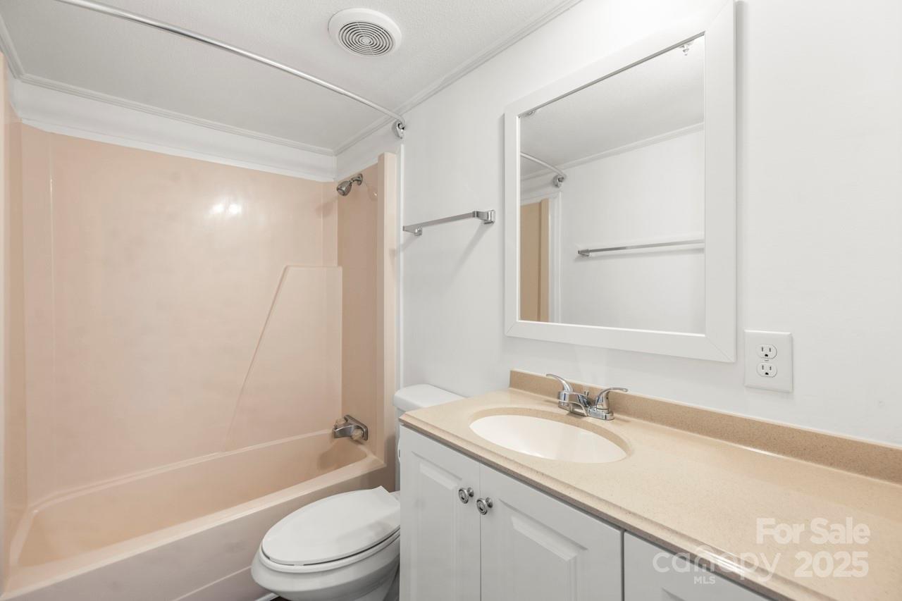 5354 Sherrills Ford Road Catawba, NC 28609 - Photo 26 of 44 a bathroom with a granite countertop sink a toilet and shower