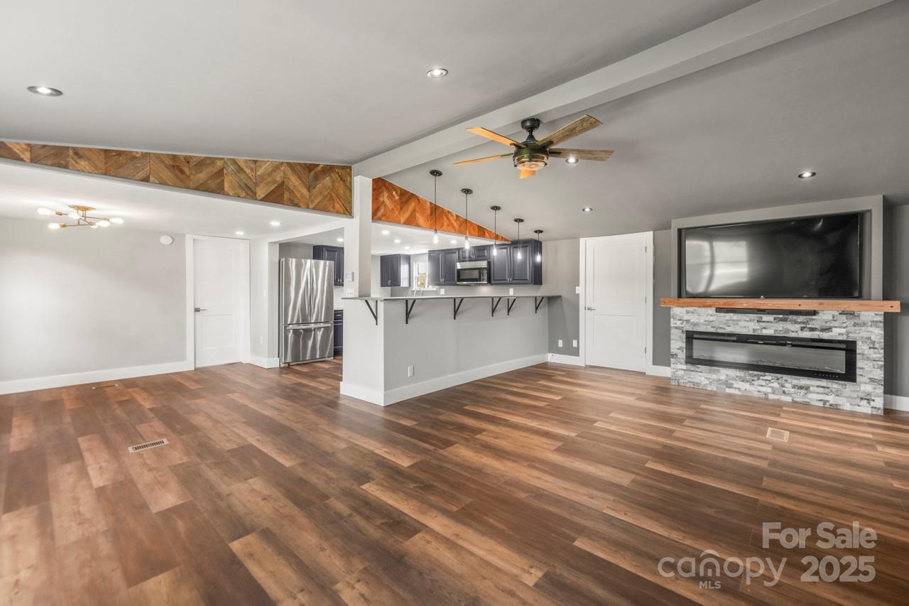 5354 Sherrills Ford Road Catawba, NC 28609 - Photo 5 of 44 a view of a kitchen with a microwave and a flat screen tv