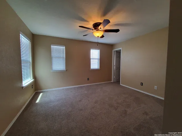 a room with a sink and cabinets