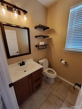 a view of a backyard with chairs