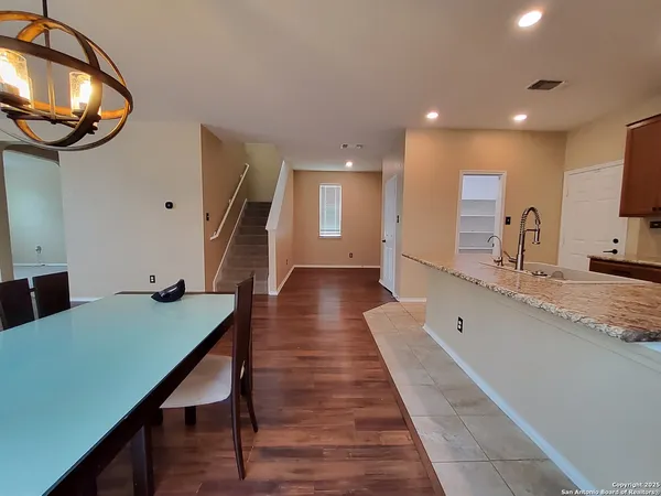 a view of a living room and a wooden floor