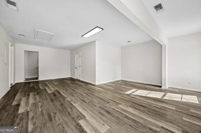 a white toilet sitting next to a bath tub
