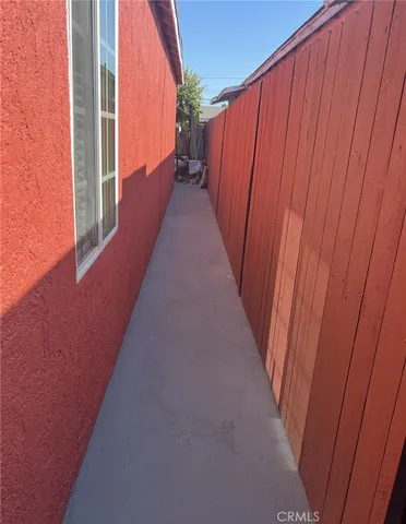 a view of a balcony with wooden fence