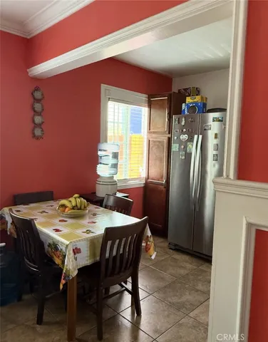 a view of a dining room with furniture and window