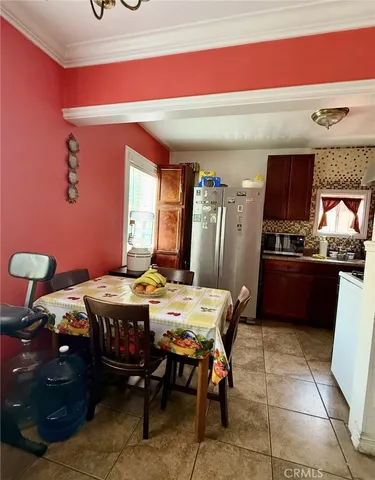 a kitchen with a table and chairs in it