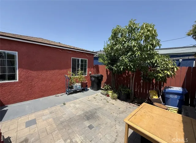 a backyard of a house with seating space
