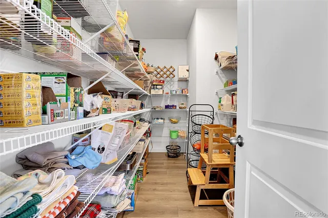 a living room with furniture a flat screen tv and a window