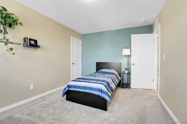 a bathroom with a double vanity sink toilet mirror and bathtub