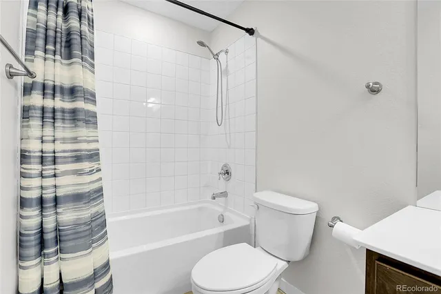 a bedroom with a bed and a potted plant