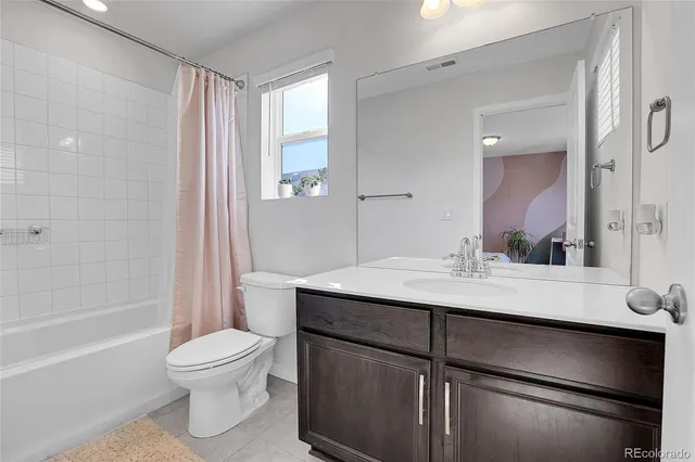 a living room with furniture and window