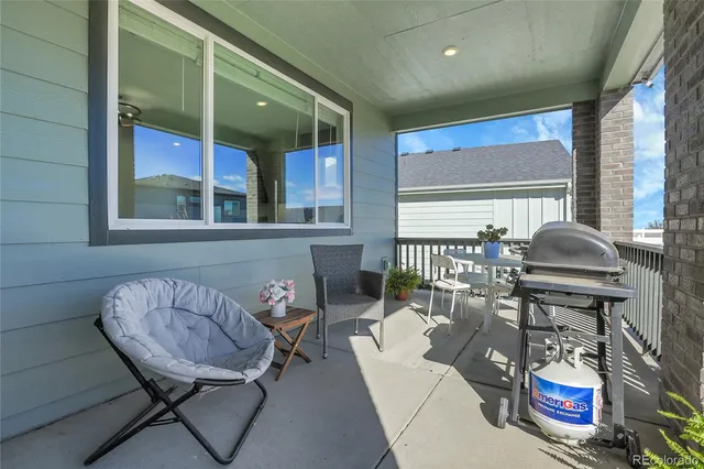 a swimming pool with outdoor seating and yard