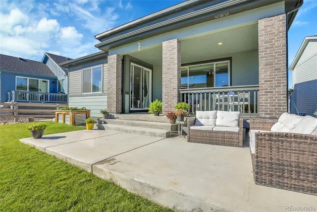 a view of a house with swimming pool and a yard