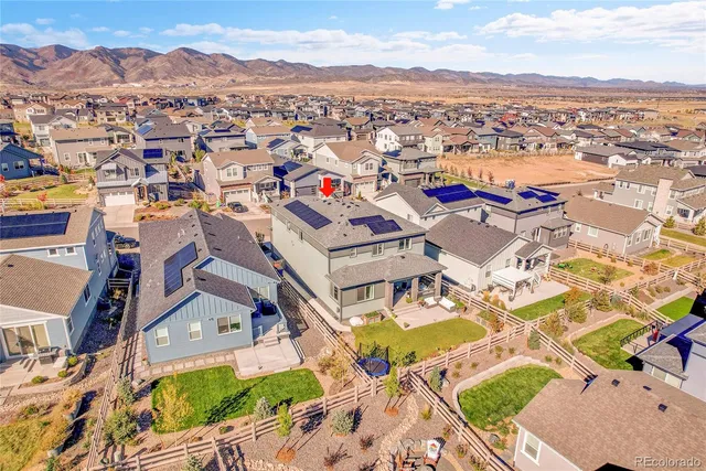 an aerial view of residential building and ocean