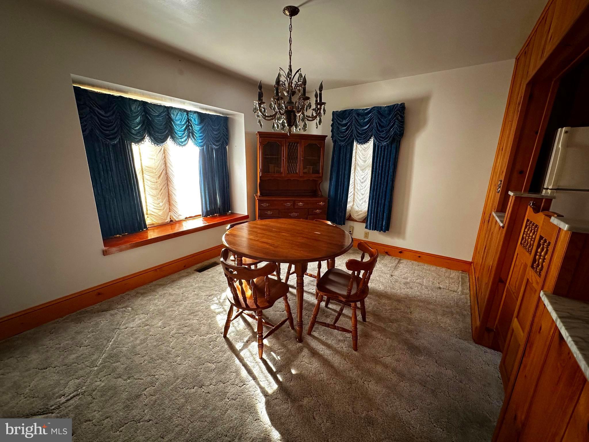 3500 Paw Paw Road Paw Paw, WV 25434 - Photo 25 of 48 a view of a dining room with furniture and window