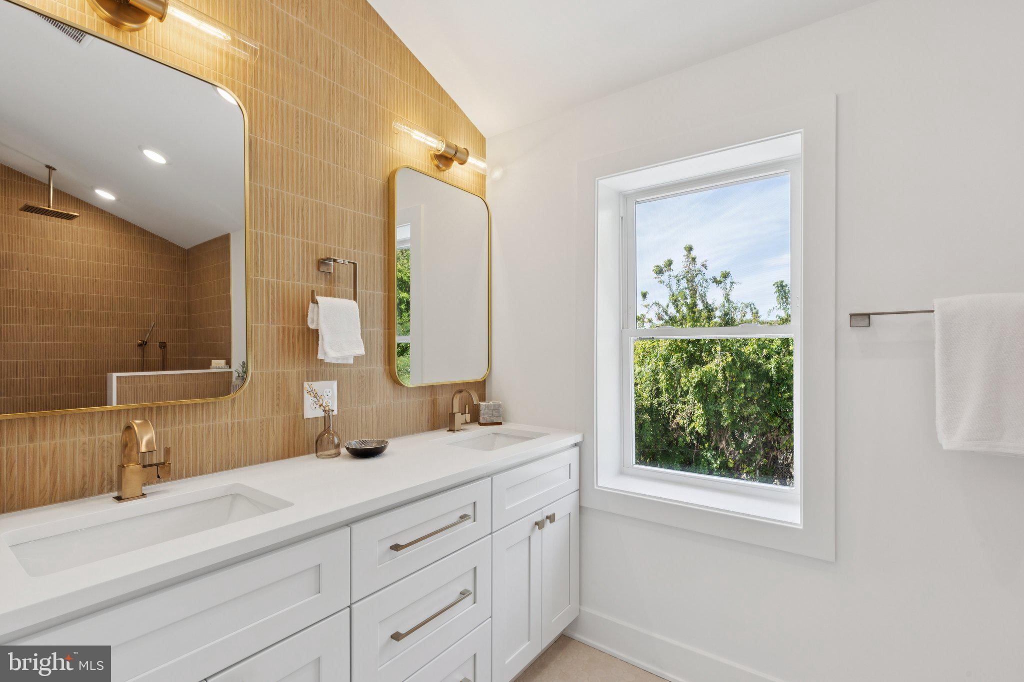 3697 Calumet Street Philadelphia, PA 19129 - Photo 14 of 34 a bathroom with a double vanity sink and a mirror