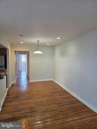 a view of a livingroom with wooden floor