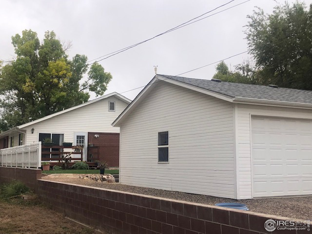 610 Oak Street Windsor, CO 80550 - Photo 2 of 3 a view of a house with a patio