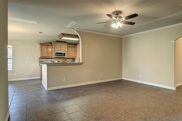 a view of a kitchen with a sink and dishwasher cabinets