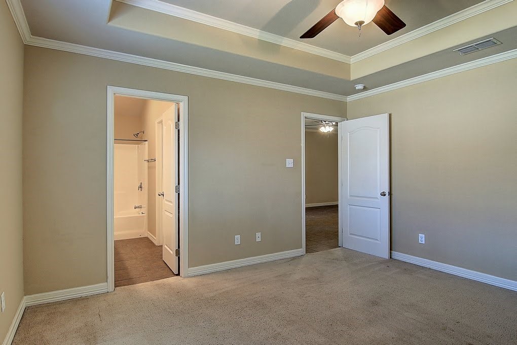 6824 Fox Tail Drive Corpus Christi, TX 78413 - Photo 20 of 40 an empty room with closet and a ceiling fan