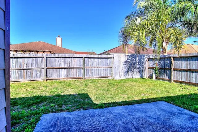 a backyard of a house with lots of green space